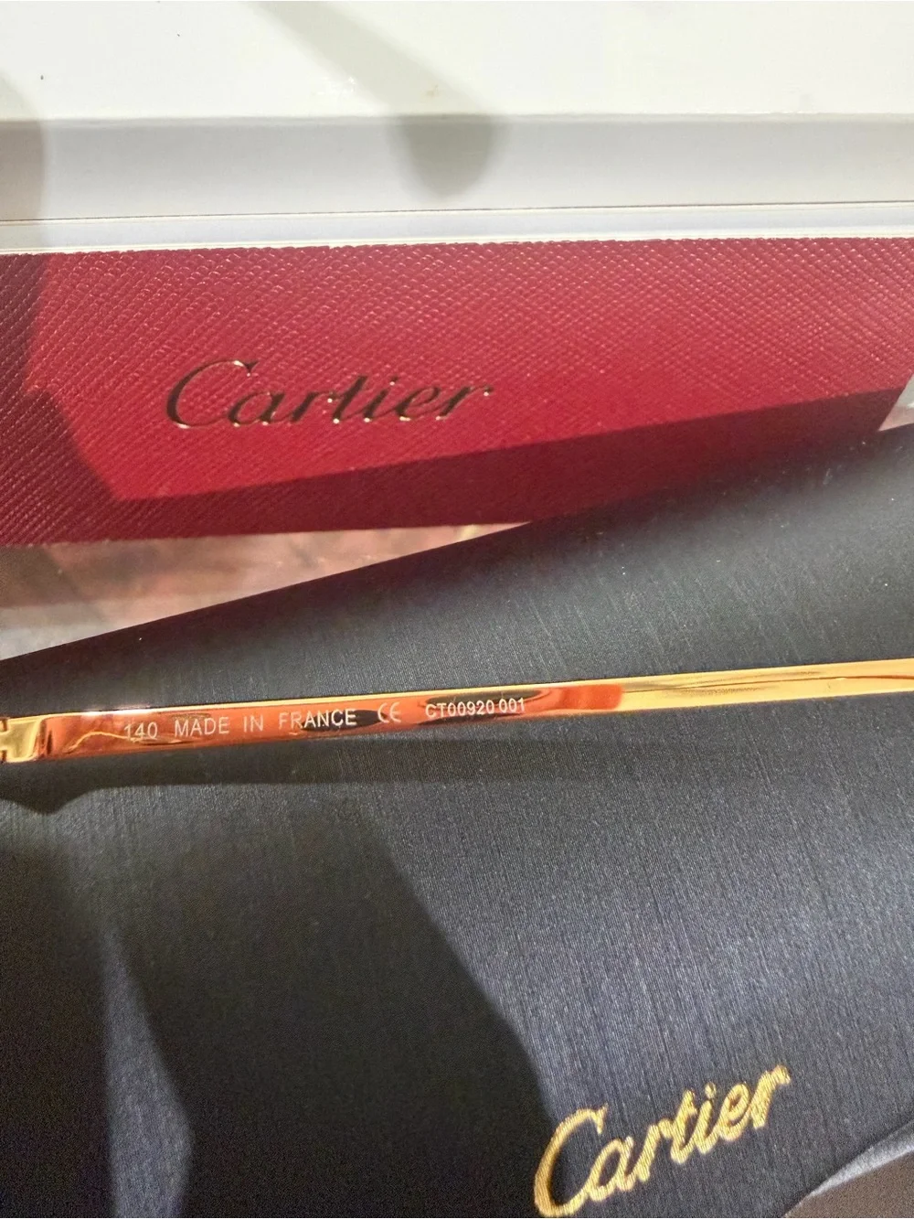 Cartier Men's Rimless Sunglasses with Purple Lenses and Gold Bridge